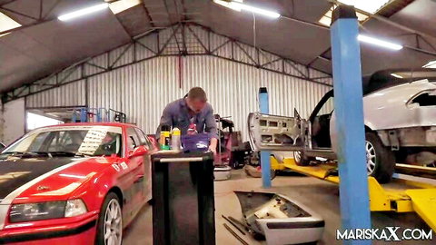 Mariska X in garage mechanic scene with cars and tools