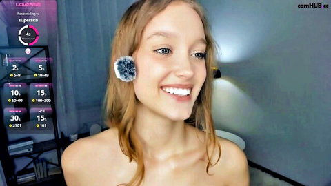 Alicemelison topless cam show, smiling redhead with fluffy earrings
