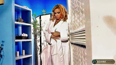 Curvy ebony woman in white robe, big boobs and ass tease