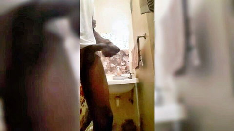 Dark-skinned man exposing ass in white t-shirt, cumming solo in amateur clip