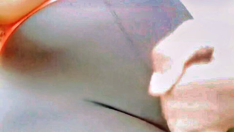 Blurry closeup of curvy Arab woman's hips in gray panties, hand on thigh