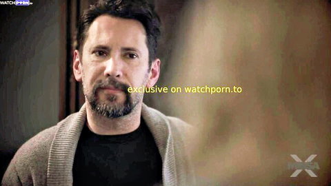 Handsome bearded man in gray cardigan stares intensely exclusive on watchporn.to