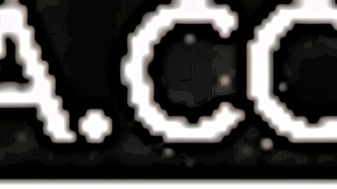 Pixelated white 'A.C.C.' logo text on black background