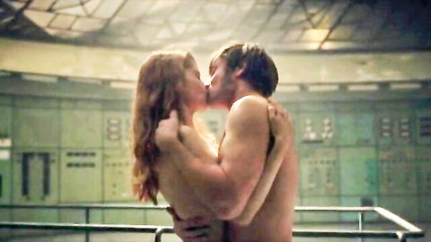 Topless redhead with medium tits passionately kissing muscular shirtless guy in sci-fi lab