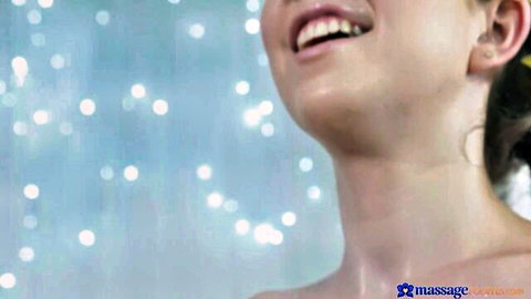 Smiling young woman in sensual lesbian massage tease, Massage Rooms