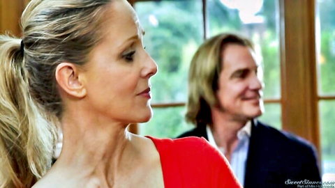 Angell Summers in red top with blonde man in passionate student exchange scene