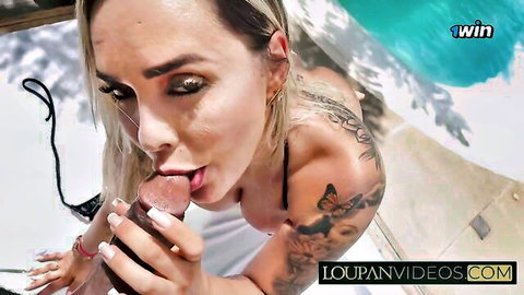 Tattooed blonde MILF giving intense POV blowjob by the pool