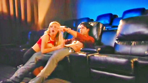 Blonde babe gropes guy in cinema seats during movie
