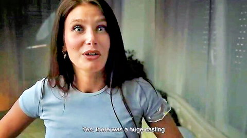 Brunette woman in casual blue top during casting couch interview