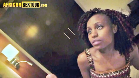 Ebony babe with braids in sparkly sequin top gazes seductively on African sex tour