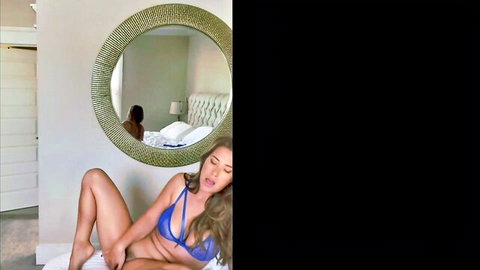 Eva Lovia in blue lingerie teasing seductively on bed