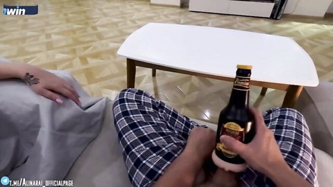 Beautiful Russian stepmom in plaid pants relaxing with partner and beer