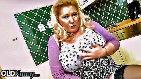 Mature blonde showing off huge boobs in leopard lingerie