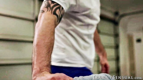 Muscular Cliff Jensen in white tee, tattooed arm, blue shorts, ready for action with Ariel Demure