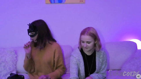 Layla Blonde and masked brunette share intimate sapphic moment on couch