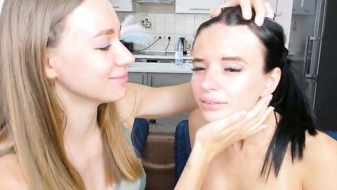 Blonde and brunette lesbians in intimate face touching fetish scene