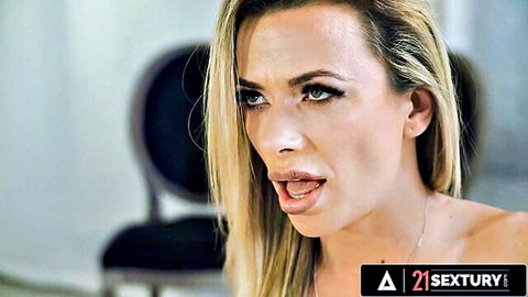 Shalina Devine blonde with open mouth seductive pose, nude shoulders