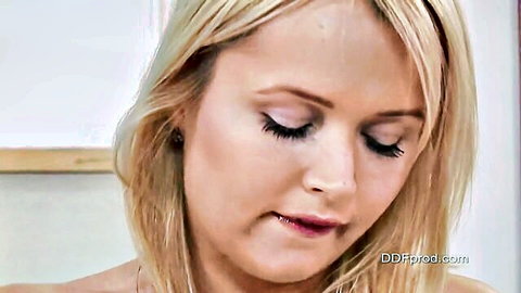Close-up of seductive blonde woman with pursed lips in Blond Aloha