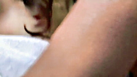 Japanese MILF with long black hair gripped roughly by man's hand on her chin in intense rough sex
