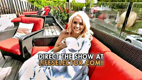 Elsa Jean cute blonde smiling wrapped in blanket holding mug