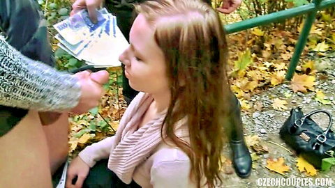 Man hands cash to kneeling blonde teen for public outdoor park blowjob