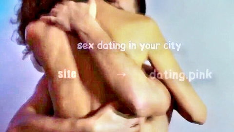 Nude skinny woman with long hair hugging naked man from behind pressing tits on his back