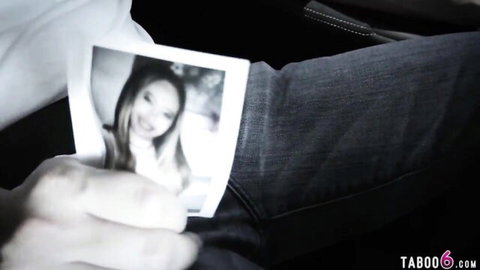 Man's hand holding Polaroid photo of smiling young Asian babe in taboo scene