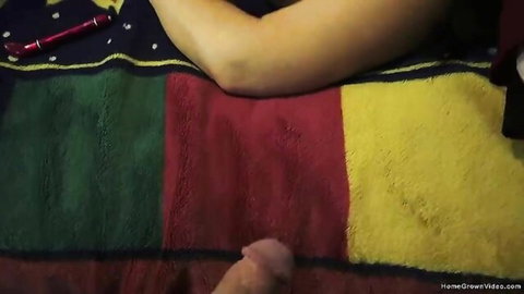 Busty MILF arm on bed guiding erect cock during masturbation