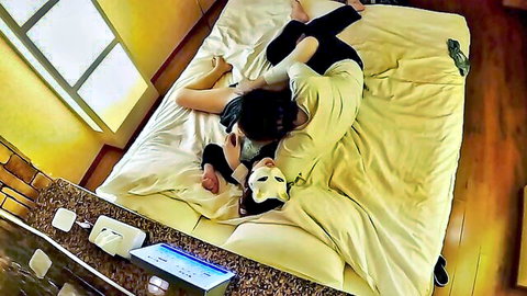 Asian woman in face mask gives blowjob and masturbates in bed with partner