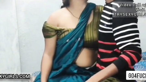 Sexy Indian wife in green saree exposes midriff teasing with lover on bed