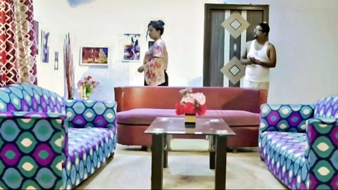 Hot Indian wife in pink outfit teasing with man in living room