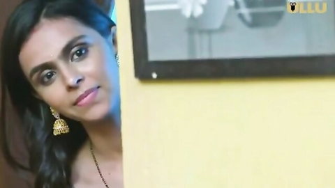 Seductive Indian woman peeking from door in Ullu erotic series