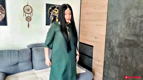 Mily Moony in seductive green dress, long black hair tease