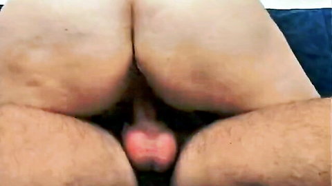 Curvy white woman's big pale ass spread wide with man's hard pink cock head between her thighs in doggy style.