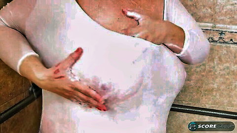 Super milf with big breasts soaping up in wet white top