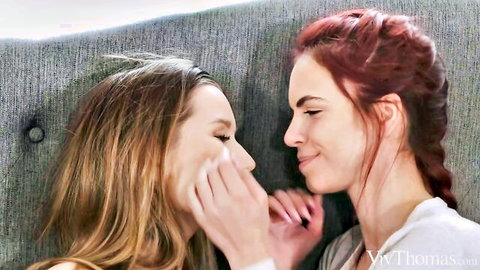 Two young beauties in sensual lesbian embrace, close-up intimate moment