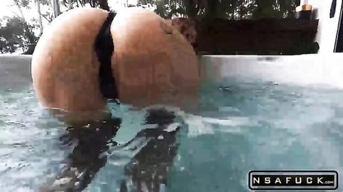 Babe bends over in hot tub showing massive wet bubble ass with black thong aside