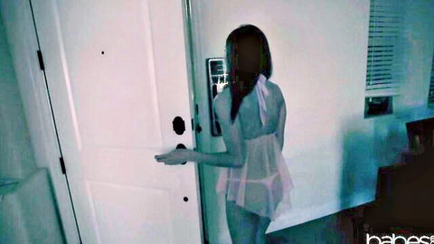 Zoe Bloom in sheer lingerie at doorway in dark outage tease