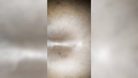 Blurry close-up of African woman in Senegal fuck video with visible cumshot