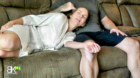 Blonde MILF and stepson cuddling intimately in robe on couch HD