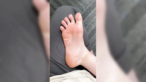 Close-up of bare foot soles in amateur foot fetish display