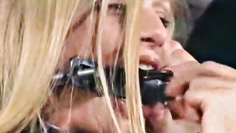Blonde woman in BDSM latex gag device, mouth open, Insex 1016 thumbnail