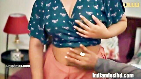 Desi Indian woman in green crop top with cleavage, touched intimately by man in Sona Ullu series