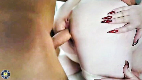 Busty mature granny with red nails takes big black dick in explicit close-up
