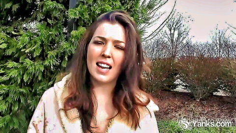 Amber Alias outdoors in fur-trimmed top, talking seductively
