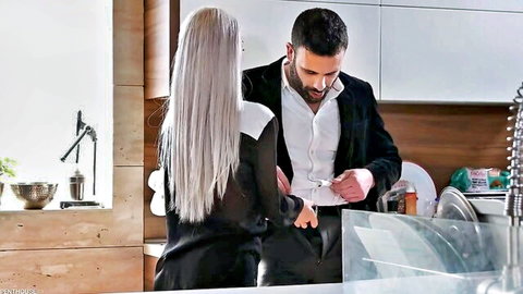 Veronica Leal in black dress teased by man in kitchen