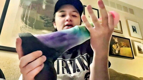 Amateur unboxing of colorful Custom Cody dildo from Exotic Erotics in Nirvana shirt
