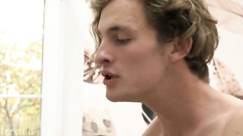 Ayden M performs oral on Gene A in intimate gay scene, shirtless blond hunk
