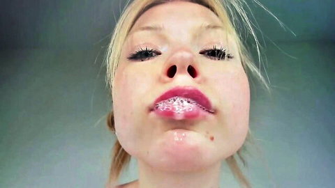 Deva Alice blonde slobbering with bubbly saliva on lips close-up