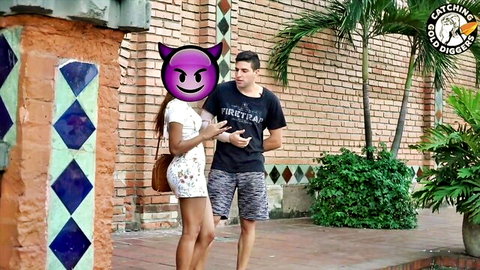 Colombian woman in short dress with juicy ass teases man outdoors